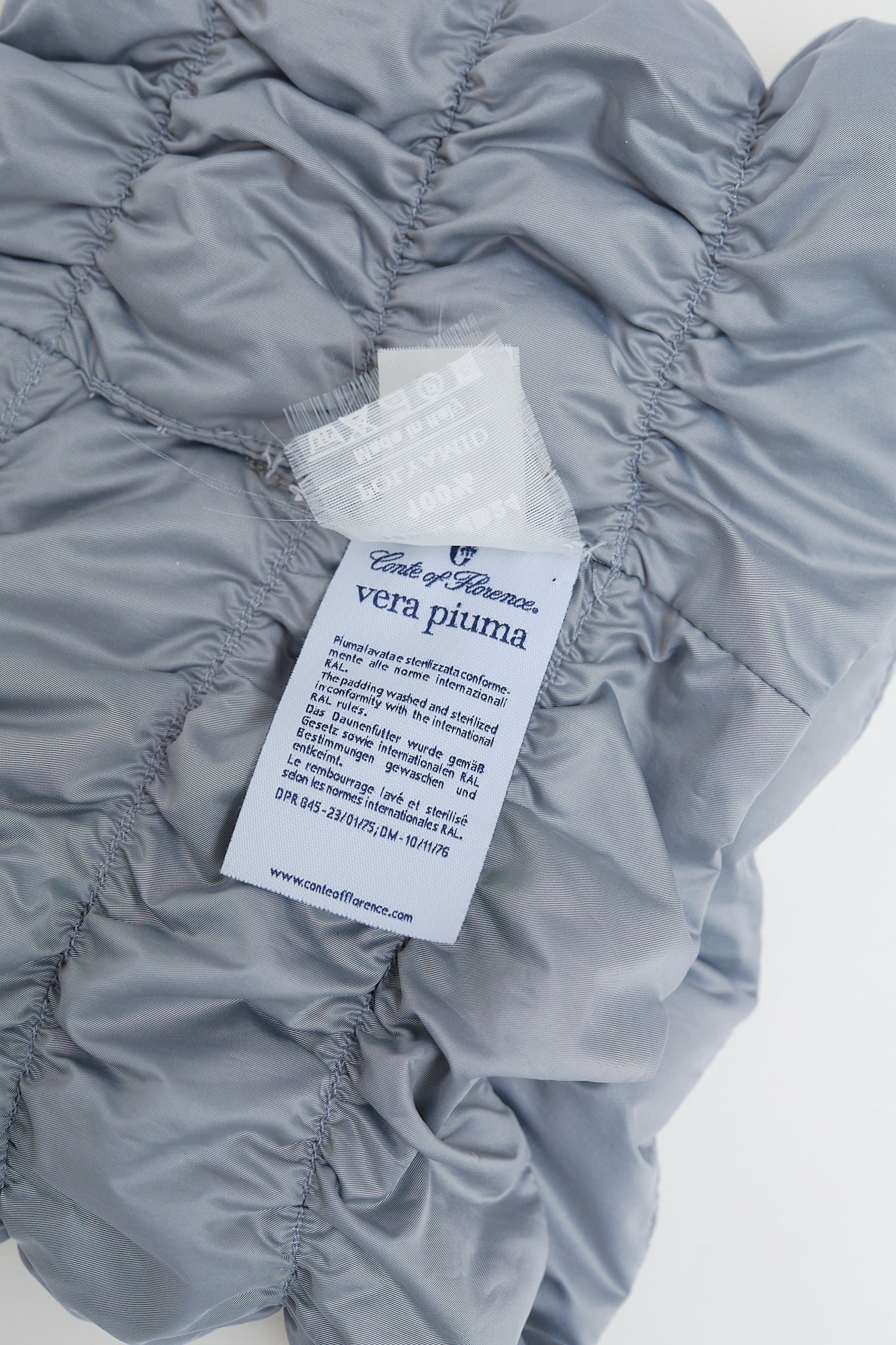 Quilted neck warmer with dawn feathers