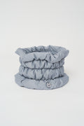 Quilted neck warmer with dawn feathers