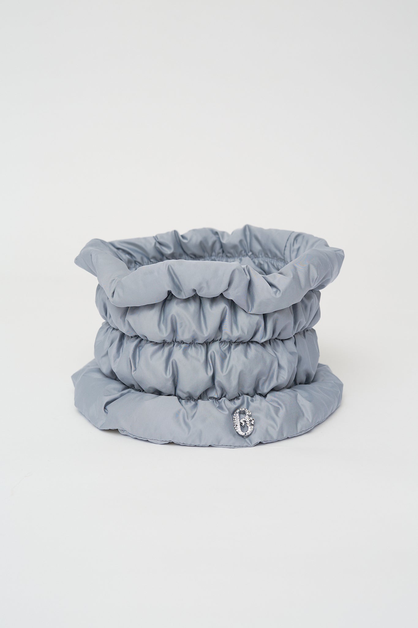 Quilted neck warmer with dawn feathers