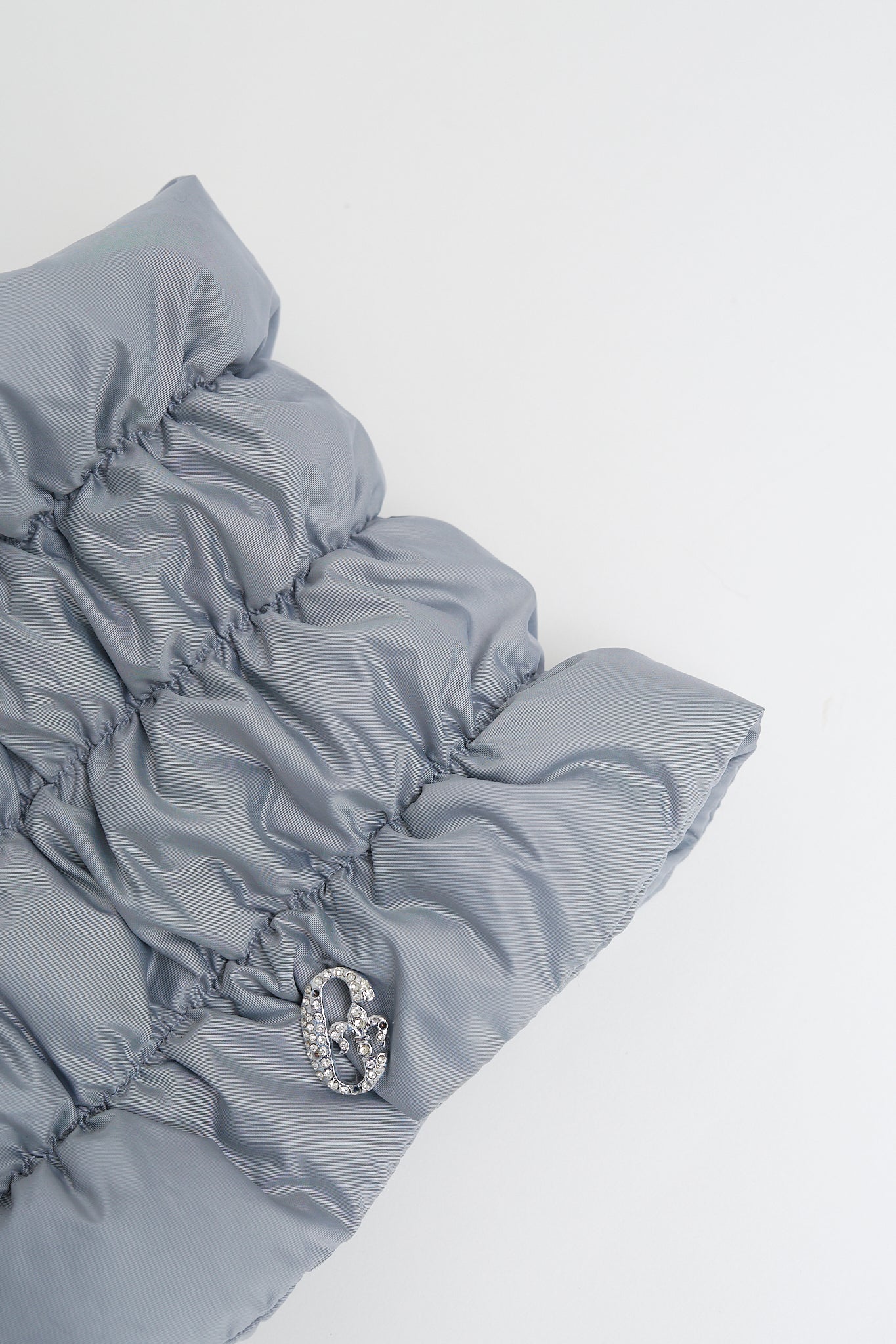 Quilted neck warmer with dawn feathers